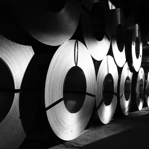 Stacked rolls of steel coil in a warehouse
